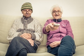 old couple watching tv
